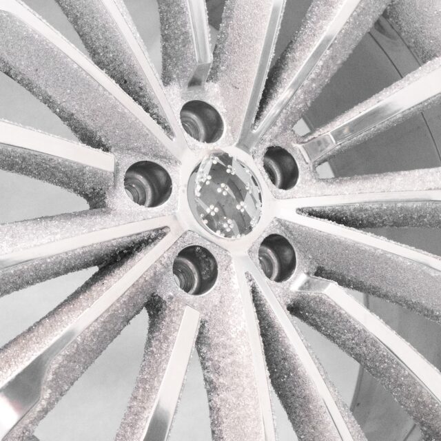 Aluminum wheel disk inlaid with crystals shines at show