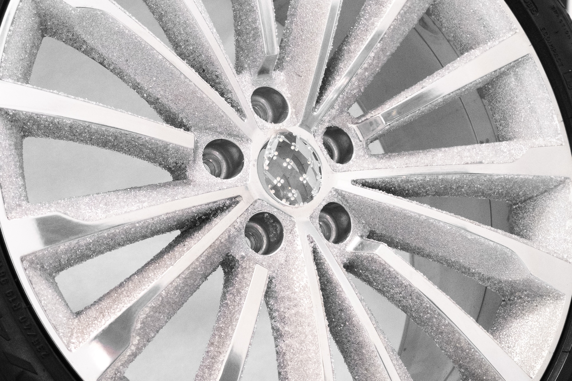Aluminum wheel disk inlaid with crystals shines at show